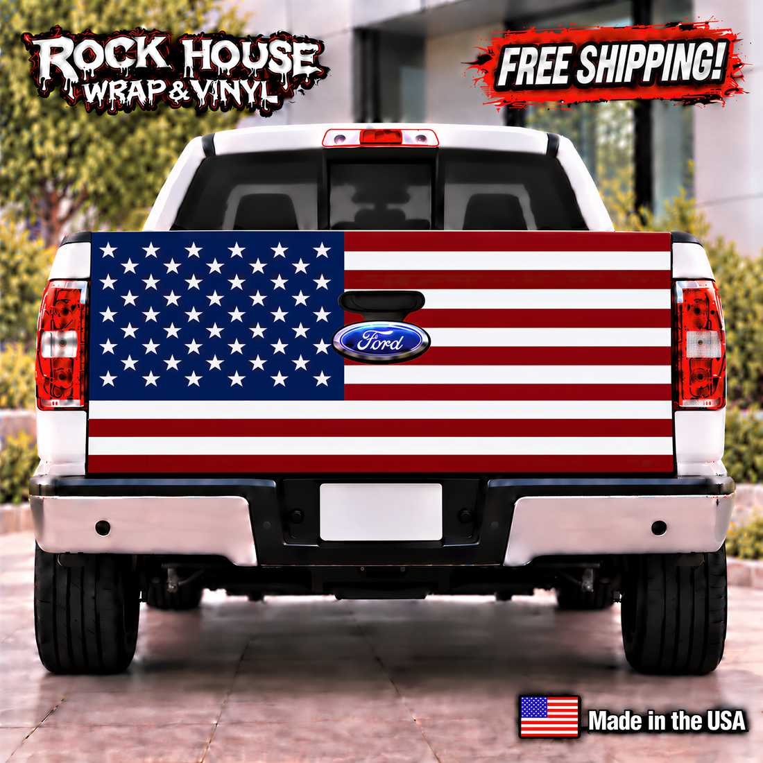 a white Ford truck with a large American flag decal on the rear. The truck is parked on a paved surface, and there is a "Rock House Wrap & Vinyl" advertisement above it. The truck has a "Ford" logo on the trunk, and there is a "Made in the USA" label at the bottom of the image.