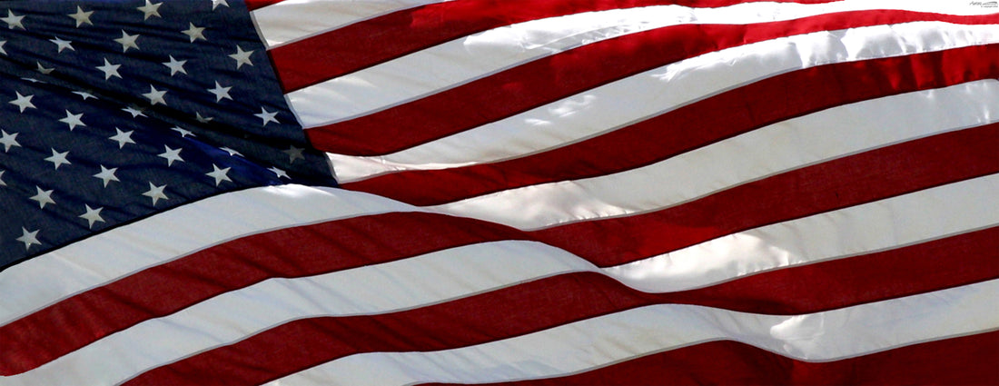 a close-up view of the American flag, with its iconic red, white, and blue stripes and stars prominently displayed.