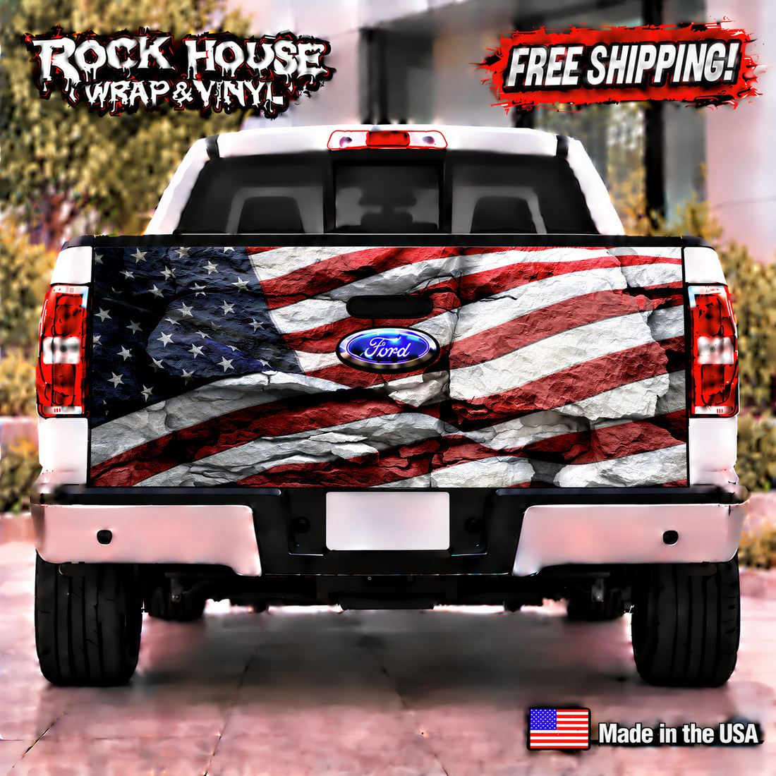 a white Ford truck with a large American flag decal on the rear bumper. The truck is parked on a street, and there is a "Rock House Wrap & Vinyl" advertisement above it.