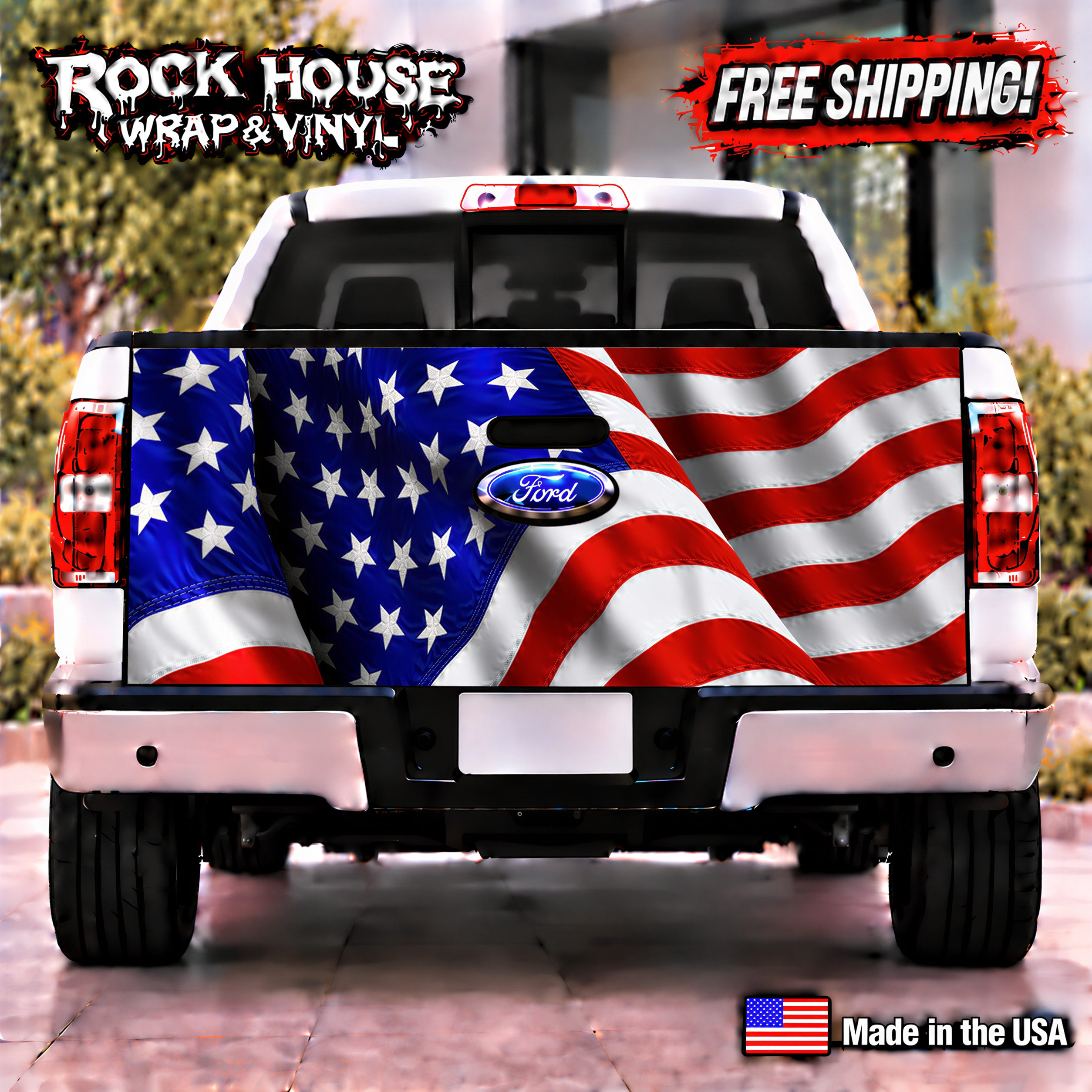 a white Ford truck with a large American flag painted on the rear. The truck is parked on a street, and there is a "Rock House Wrap & Vinyl" advertisement above it. The truck is parked in front of a building, and there is a "Free Shipping!" sign on the truck.