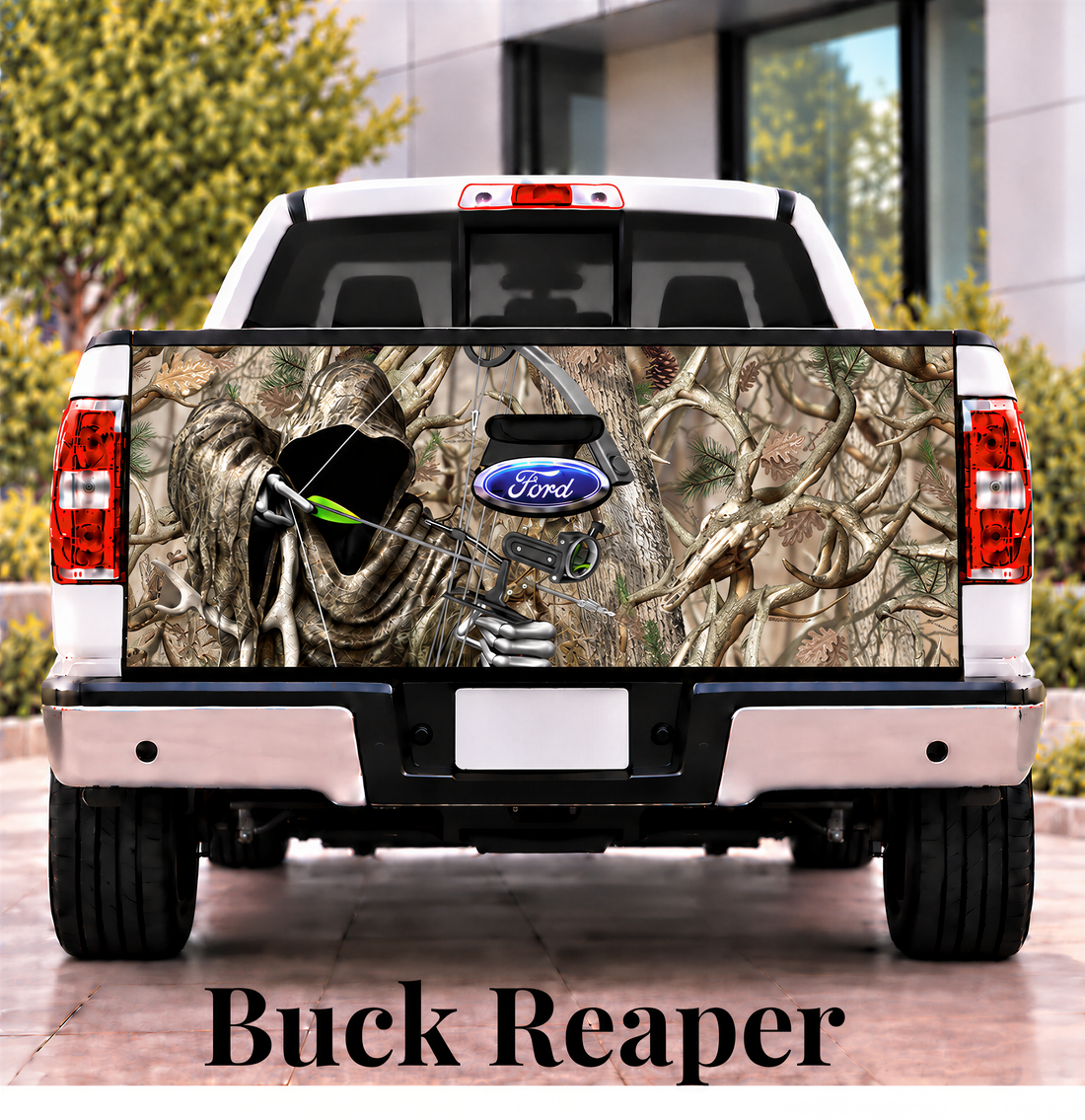 the rear of a white Ford truck with a camouflage design on the tailgate.