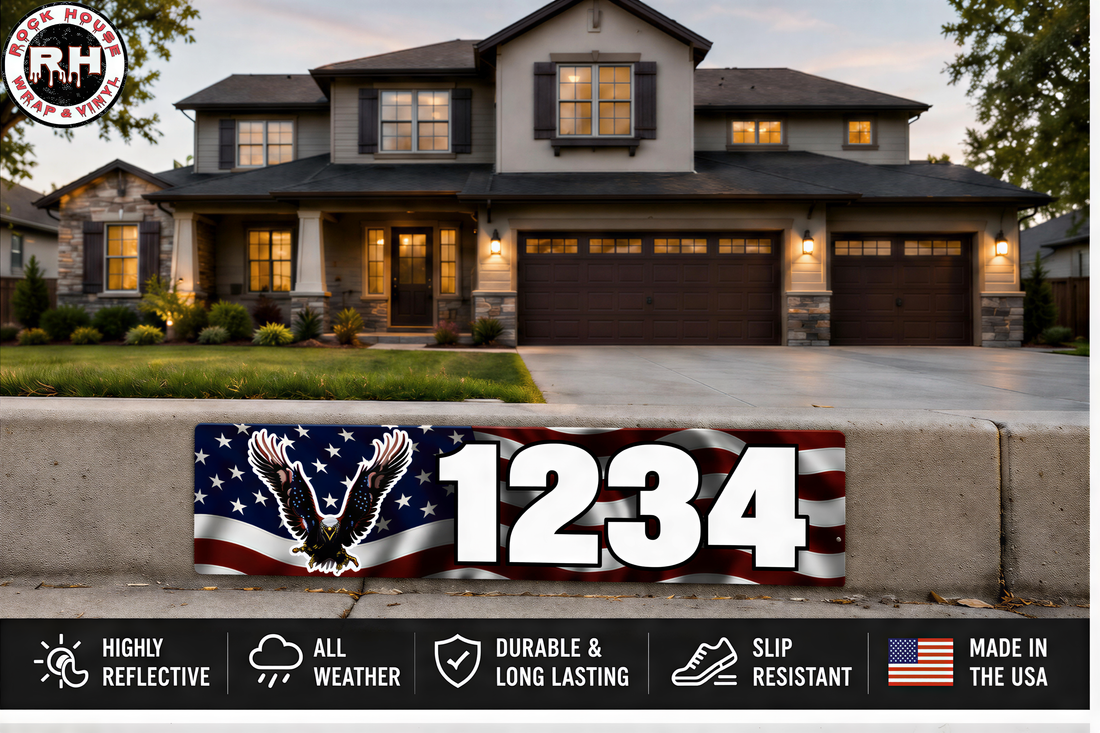 a large house with a garage, a driveway, and a sign with the number "1234" on it. The sign also displays some text and logos related to the house and the neighborhood.